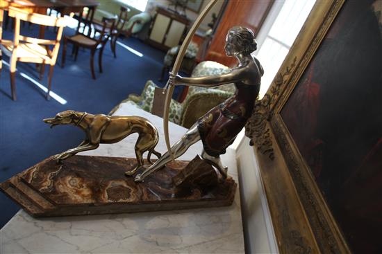 A French Art Deco silvered and painted model of a huntress, 23in.